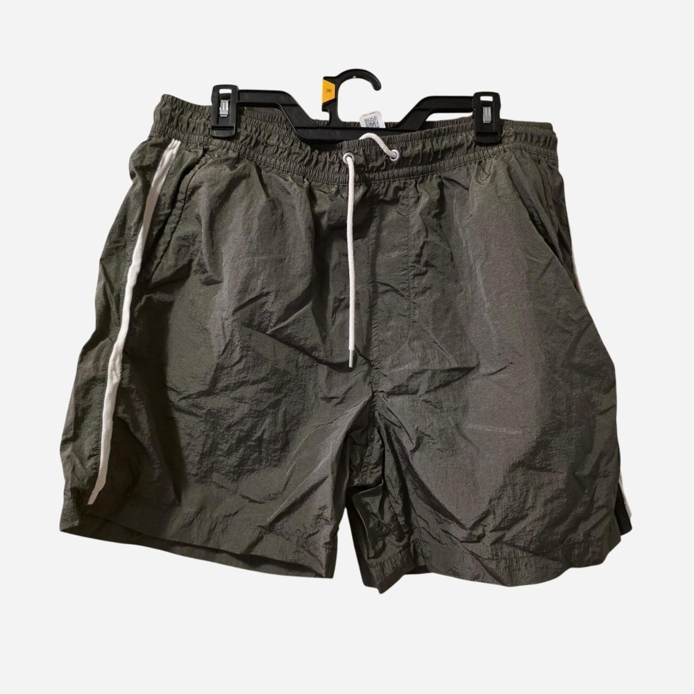 Olive green shorts with white side stripes